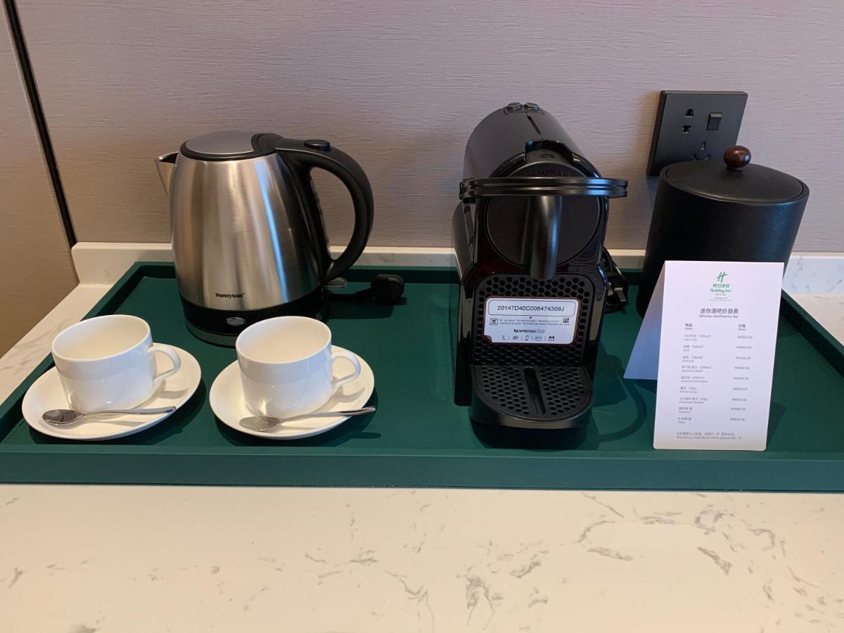 Holiday Inn Shanghai Nanjing Road By Ihg Exterior photo A Nespresso coffee machine in a hotel room